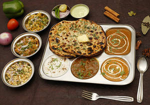 Dilli Special Tandoori Paratha Thali With Shahi Paneer.