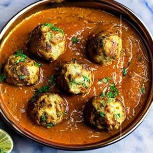 Malai Kofta in Yellow Gravy