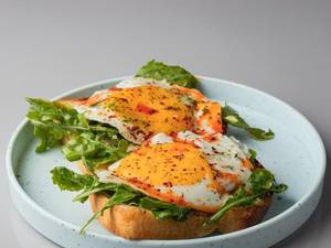 Fried Eggs And Chilli Oil With Arugula