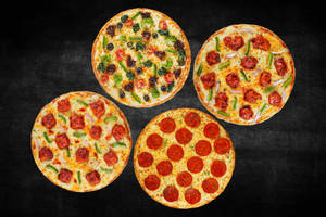 4 Veg & Non-Veg Medium Pizzas at 329 Each