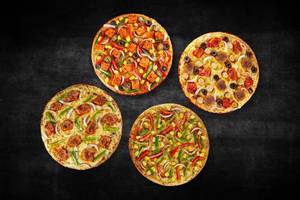 4 Veg & Non-Veg Regular Pizzas at 199 Each