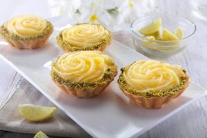Lemon Tart ( served with cream) ( 436.7 Kcal ) (100g )