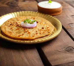 Aloo Pyaaz Paratha Served Curd