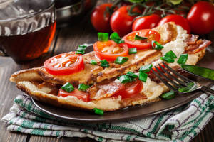 Omelette Stuffed With Cheese And Tomatoseason With Oregano