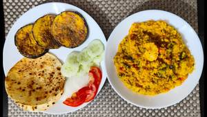 Gobindobhog khichdi , begun bhaja 2 pieces , papad and achar
