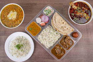 Non Veg Thali ....butter Chicken+chaap Gervy+ Rice+4 Roti+salad
