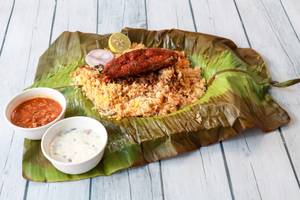 Thalassery Avoli Pothi Biryani wrapped in Bana Leaf
