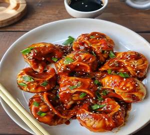 Veg Schezwan Glazed Momos