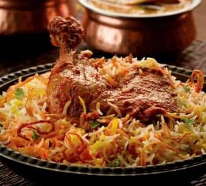 Chicken biryani with gravy and raita