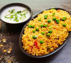 Masala Green Peas Rice With Raita