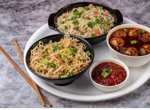 Veg Fried Rice + Veg Hakka Noodles + Veg Manchurian Gravy (4pcs)