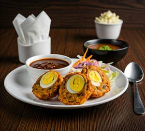 Egg Pakora (04 Pieces) Served With Chutney, Pickle & Salad.