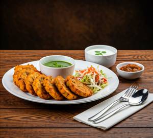 Paneer Pakoda (06 pieces) - served with Pickle, Chutney, Curd & Salad.