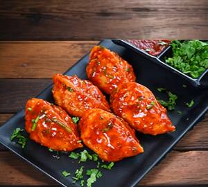 Veg Momos In Peri Peri Sauce [Half]