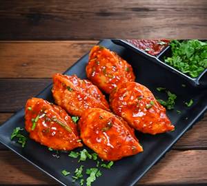 Paneer Momos In Peri Peri Sauce [Half]