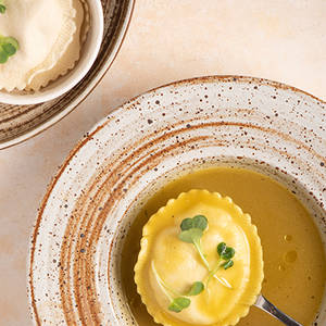 HEARTY PUMPKIN BROTH WITH 4 CHEESE RAVIOLI