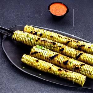 Charcoal grilled baby corn hariyali