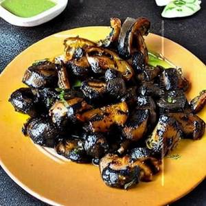 Charcoal grilled achari mushroom