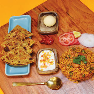 Combo 1: Aloo Paratha+tawapulav+sweet+raita+pickle+salad