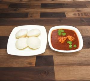 Idli with meen kolambu