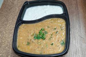Moong dal khichdi + curd + pickel