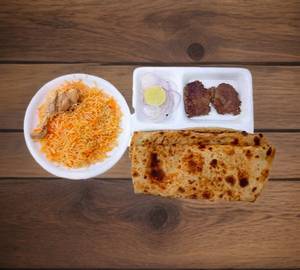 Chicken biryani chicken kabab 2+ Paratha 2 + chicken fry 3 + Raita