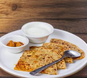 2 aloo pyaaz paratha with butter and pickle