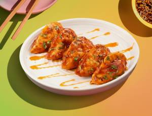 Veg Schezwan Pan-tossed Momos