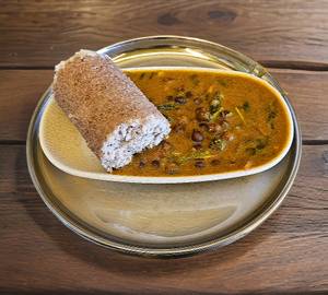 Brown broken rice puttu with kadala curry