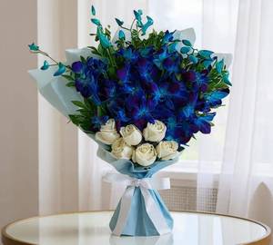 Blue orchids white roses bouquet