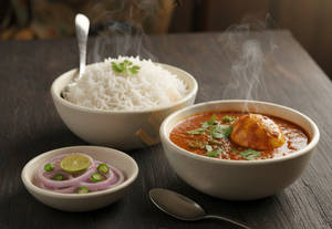 Egg Curry With Rice And Salad Meal