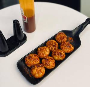 Chicken peri peri steamed momos [8 pieces]