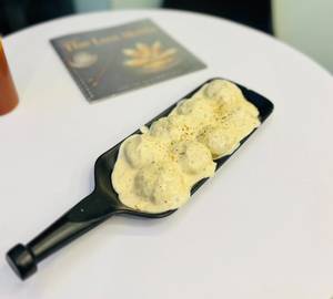 Chicken rich cream steamed momos [8 pieces]