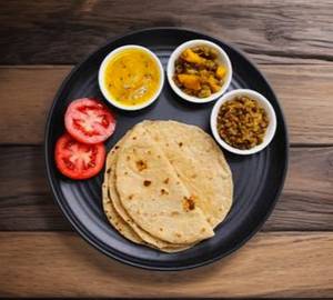 Stylish Thali 4 desi ghee roti with sahi paneer sukhe aalu achar and salad 