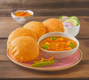 Aloo ki sabji with [8poori]