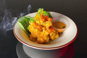 Crispy Tempura Corn Tossed In Spicy Seasoning.