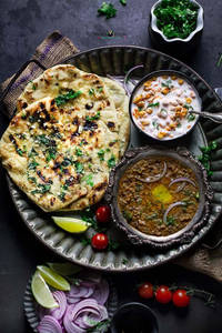 Paneer Naan (1Pc) With Dal Makhani and Raita