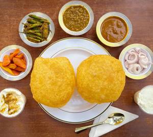 1 Plate Poori Chole + 1 Sweet/Salty Lassi