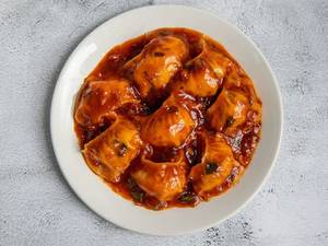 Chicken Momos -  Schezwan Gravy
