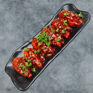 Chicken Pan Fried Momos In Chilli Gravy (6 Pcs)