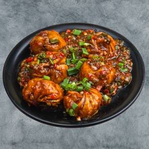 Veg Pan Fried Momos In Chilli Gravy (6 Pcs)