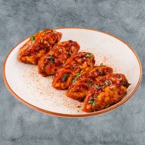 Pan Fried Paneer Momos In Chilli Gravy (6 Pcs)