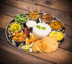 10 puri+dal+veg sabji+gatte ki sabji+rice+salad+achar+chhach