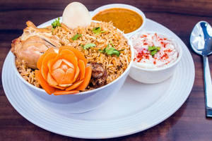 Chicken Dum Biryani + Pepsi ( Served With Salad, Gravy )