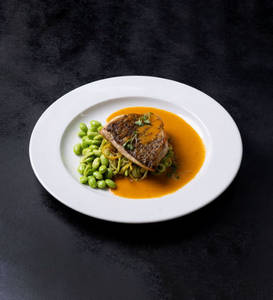 Pan seared Sea Bass, Lobster cream sauce