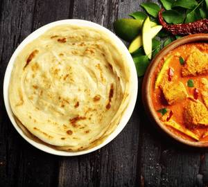 Coconut mango fish curry with two Malabar parotta