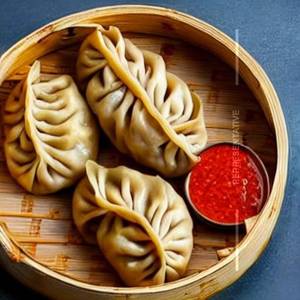 Steamed peri peri chicken momos