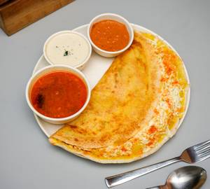 Cheese dosa topped with bombay chutney