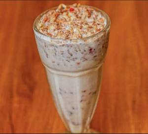 Puffed Rice Flakes Along With Ripe Bannana Dry Fruits Milk Of Any Kind