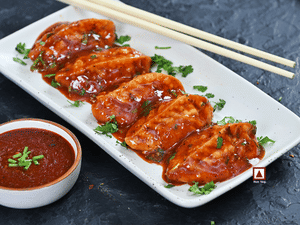 Chicken Pahari Feast Pan Fried Momo in Tomato Garlic Sauce